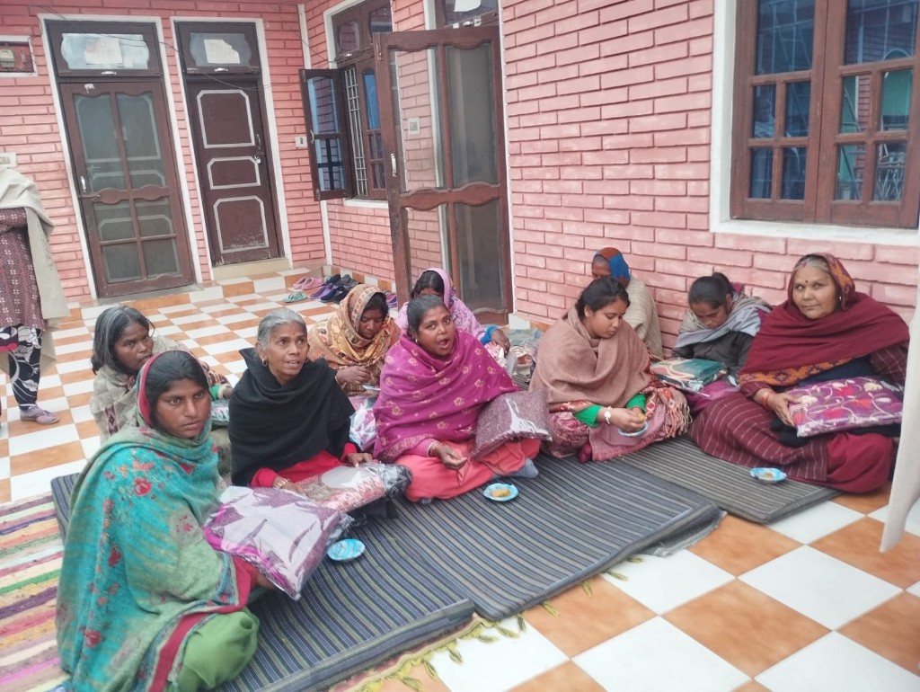 Women residents gather in the shelter courtyard